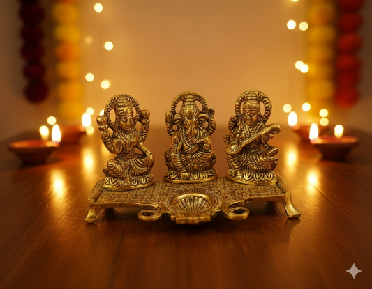 Metal Trio Statues with Diya – Lakshmi, Ganesh & Saraswati for blessings and light.